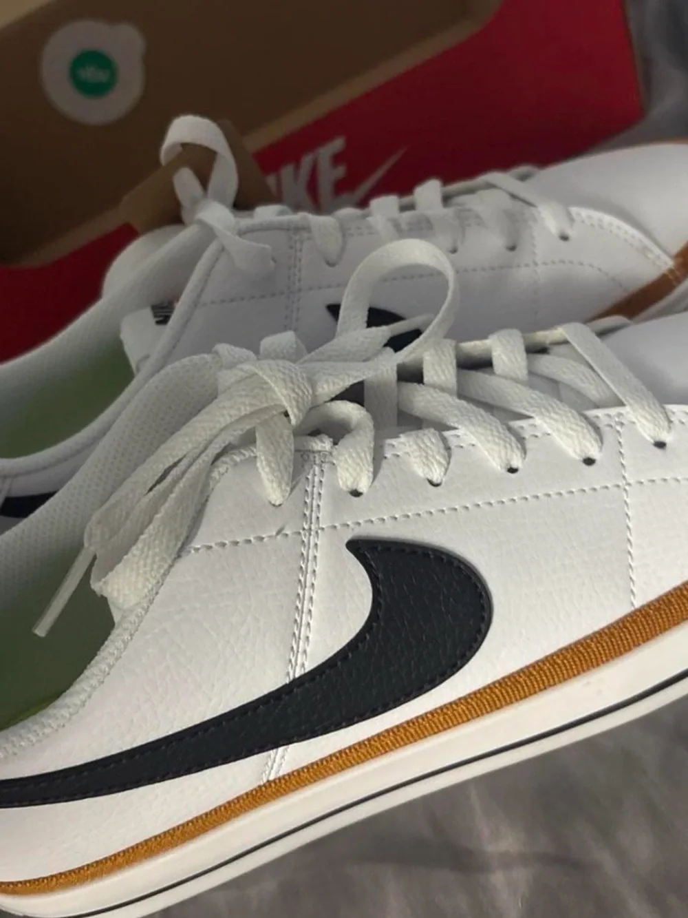 Nike Women’s White Sneakers with Black Swoosh and Brown Trim